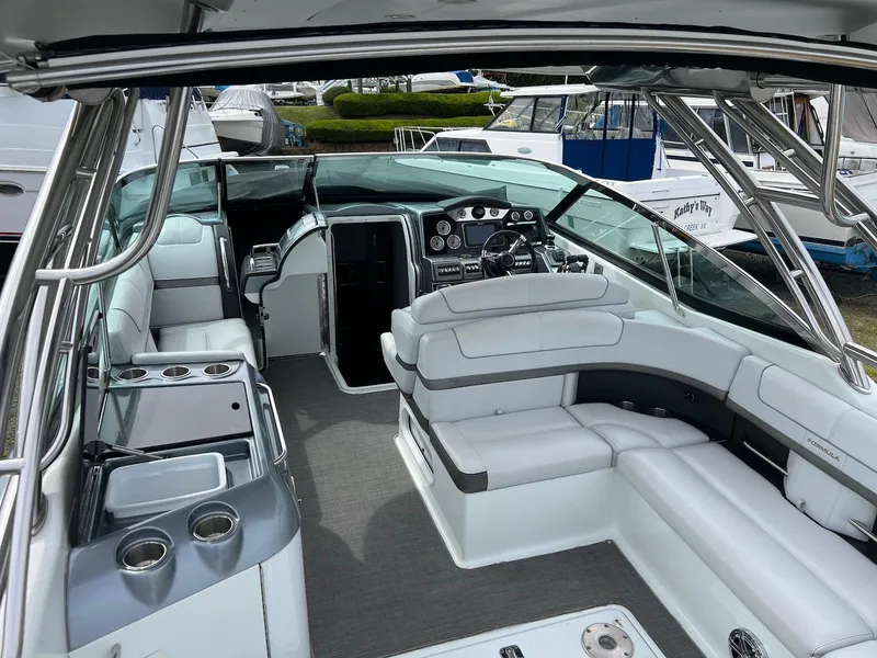 Slide: The Image of 2015 Formula 350 Crossover Bowrider interior with luxurious seating and modern dashboard. - 10