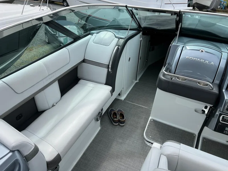 Slide: The Image of 2015 Formula 350 Crossover Bowrider interior with white seating and dashboard. - 13