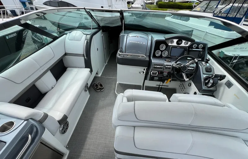 Slide: The Image of 2015 Formula 350 Crossover Bowrider interior with modern dashboard and seating. - 15