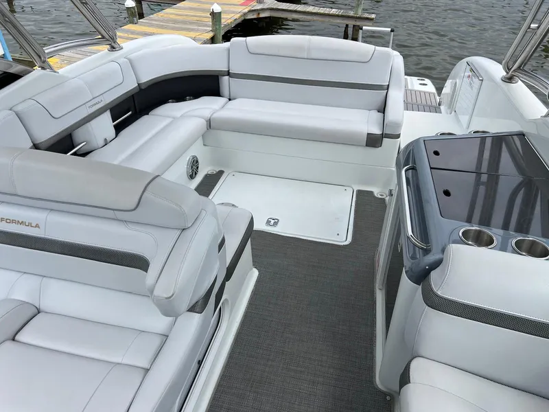 Slide: The Image of 2015 Formula 350 Crossover Bowrider interior with spacious seating and sleek design. - 16