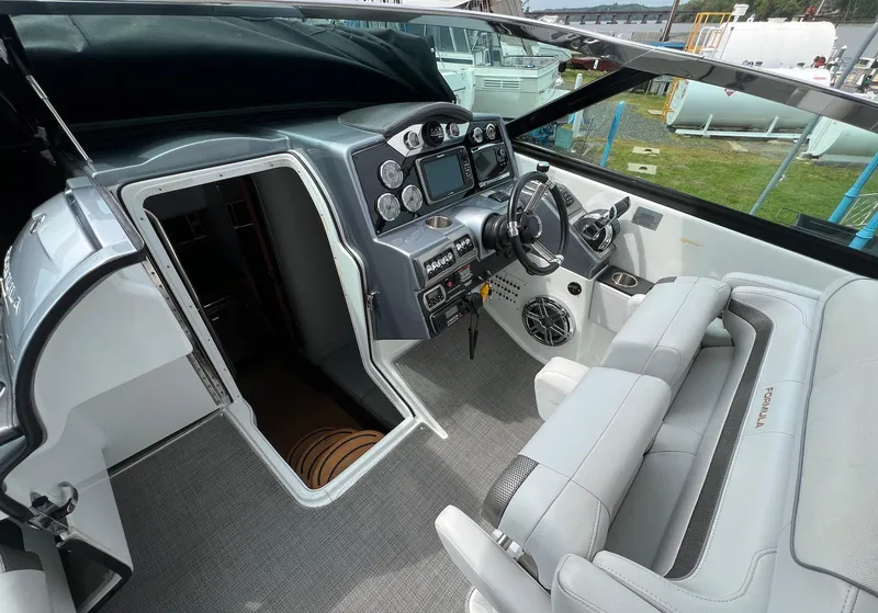 Slide: The Image of 2015 Formula 350 Crossover Bowrider cockpit with modern controls and plush seating. - 18