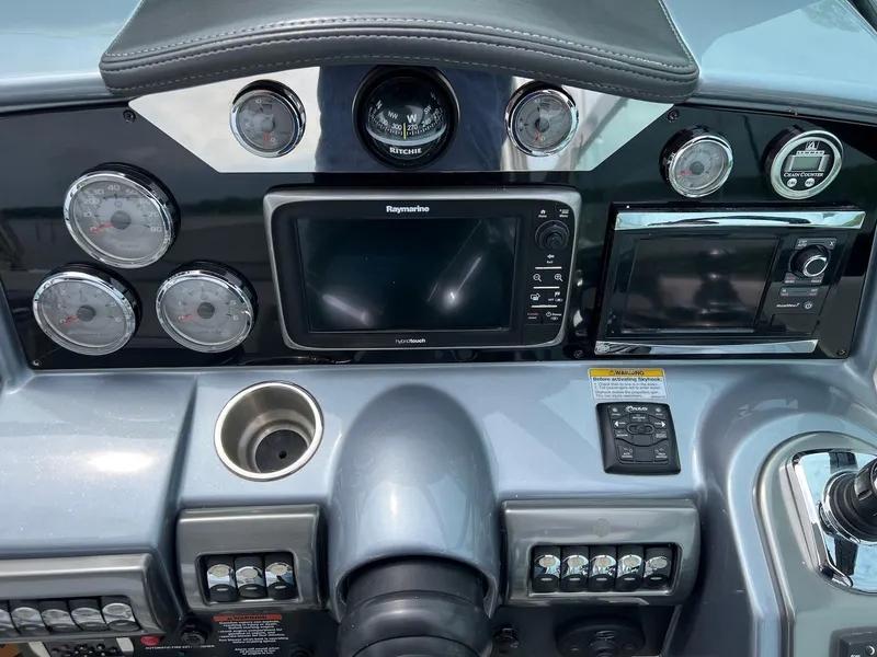 Slide: The Image of Dashboard of a 2015 Formula 350 Crossover Bowrider with navigation and control instruments. - 19