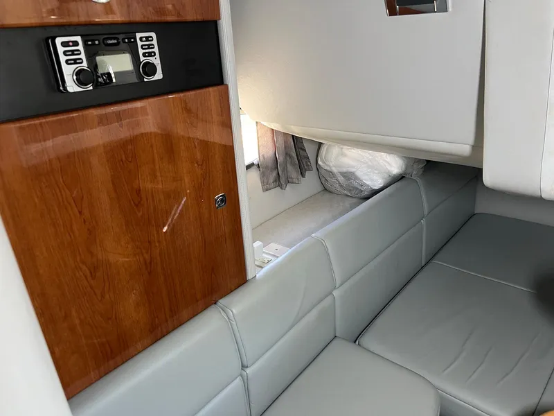 Slide: The Image of 2015 Formula 350 Crossover Bowrider interior with wood paneling and gray seating. - 29