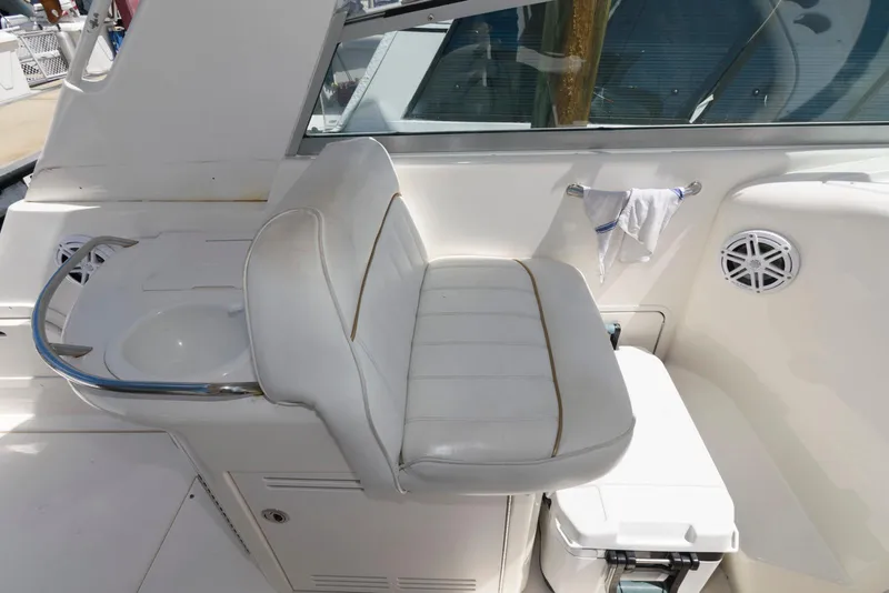 Slide: The Image of 1998 Sea Ray 330 Sundancer helm with steering wheel and navigation equipment. - 3