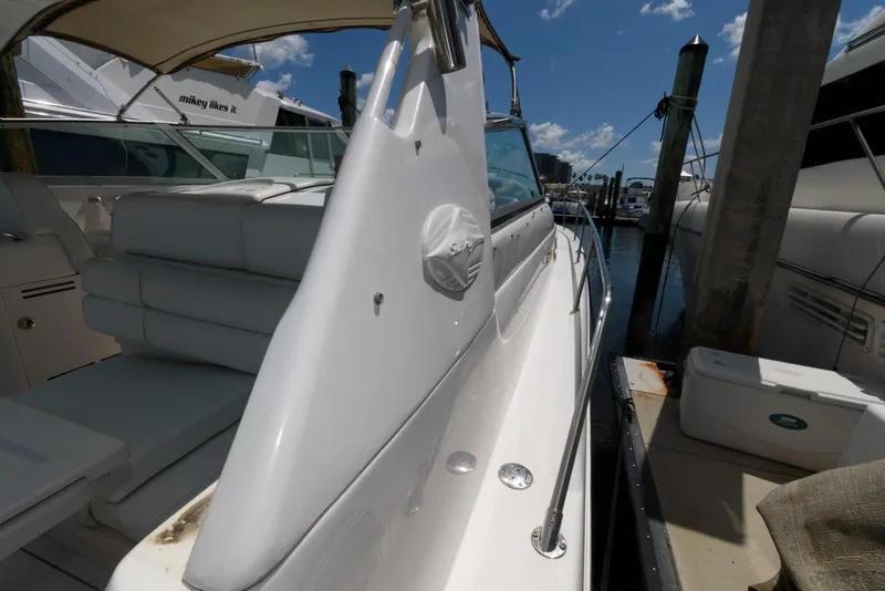 Slide: The Image of 1997 Sea Ray 330 Sundancer boat interior with sink and seating area. - 7