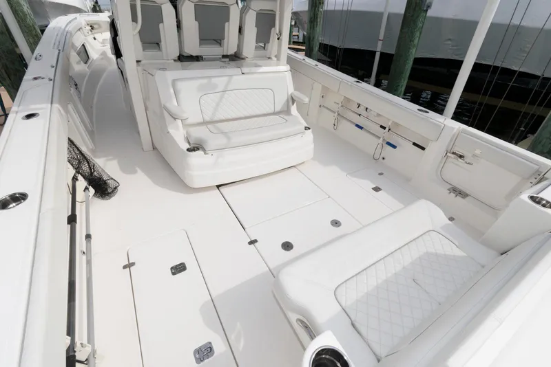 Slide: The Image of 2022 Pursuit S 378 Sport boat interior with white seating and spacious deck. - 7