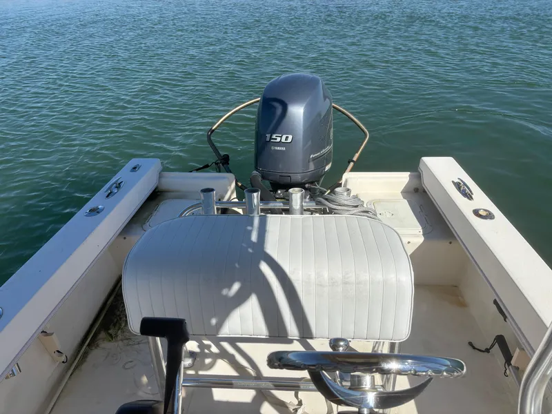 Slide: The Image of 2005 Jones Brothers 18 Cape Fisherman boat with Yamaha 150 engine on water. - 13