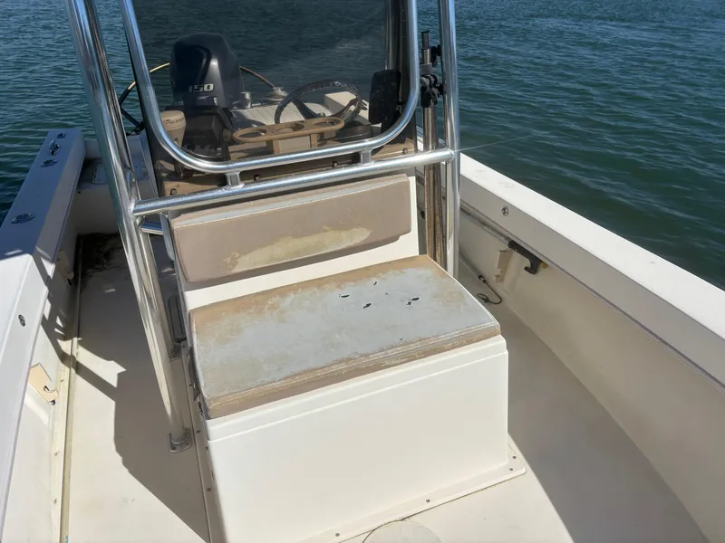 Slide: The Image of 2005 Jones Brothers 18 Cape Fisherman boat interior with seating and steering console. - 14