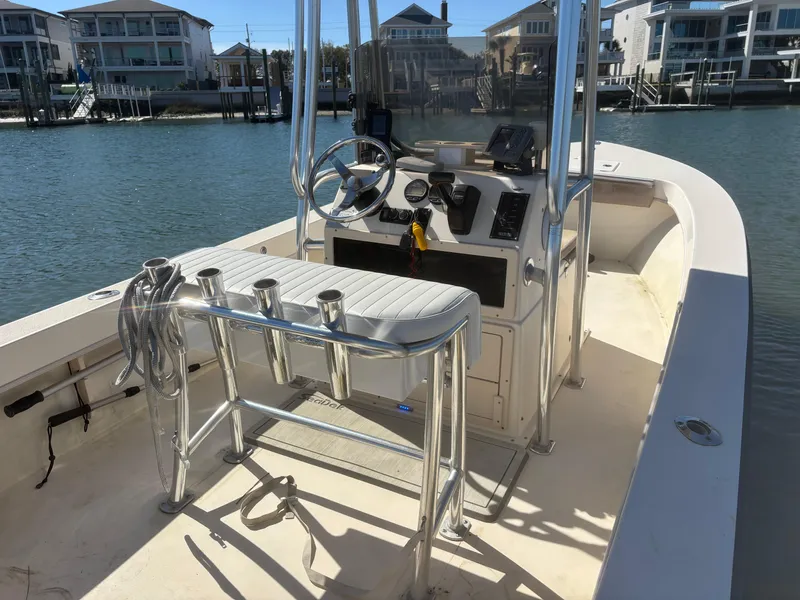 Slide: The Image of 2005 Jones Brothers 18 Cape Fisherman boat docked by waterfront homes. - 6