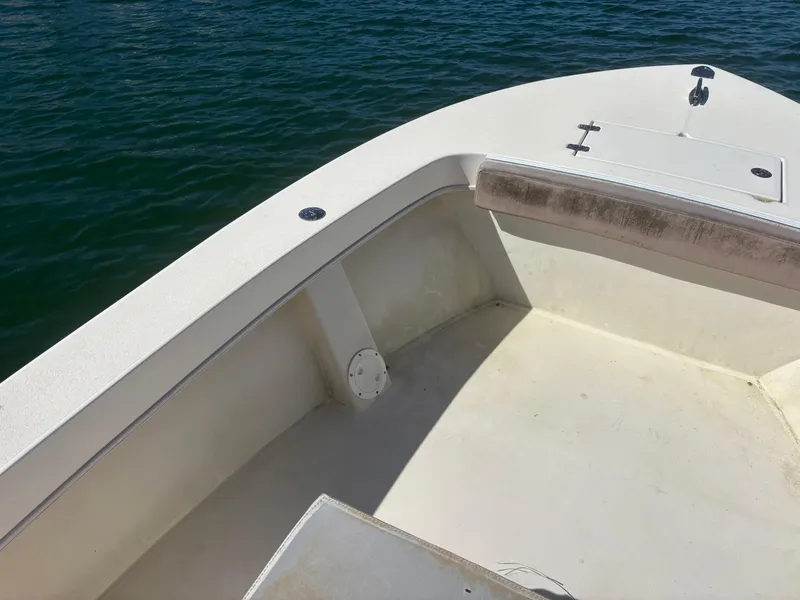 Slide: The Image of 2005 Jones Brothers 18 Cape Fisherman boat interior with open deck and storage compartment. - 9