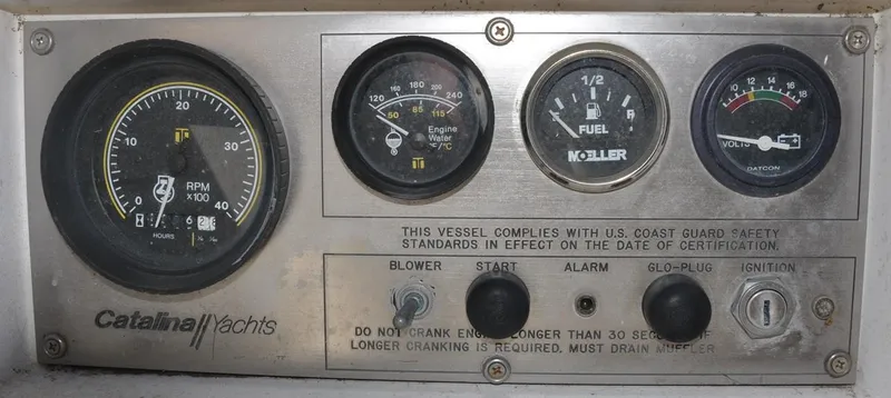 Slide: The Image of Control panel of a 1987 Catalina 36 Tall Rig yacht with gauges and switches. - 13