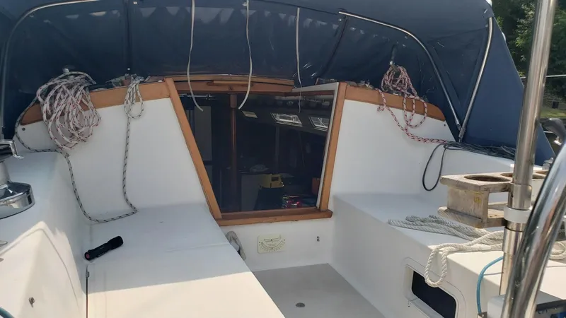 Slide: The Image of 1987 Catalina 36 Tall Rig sailboat cockpit with ropes and canopy. - 15