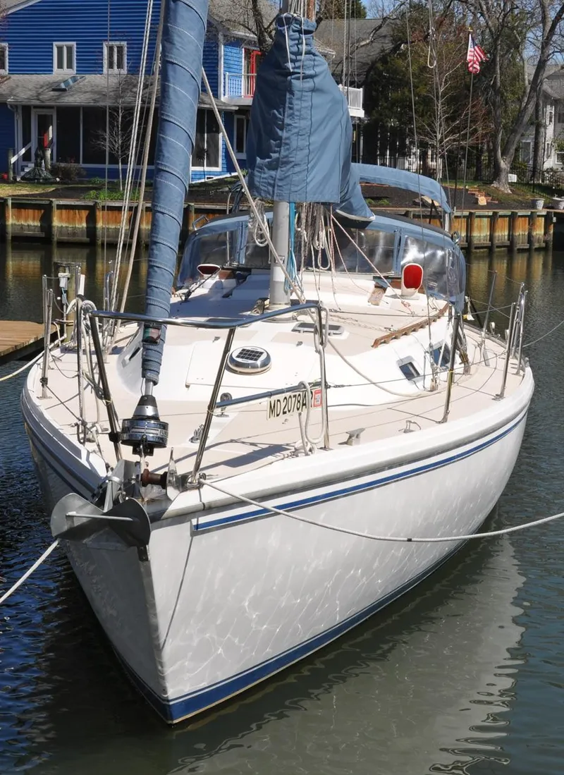 Slide: The Image of 1987 Catalina 36 Tall Rig sailboat docked in a marina, front view. - 3