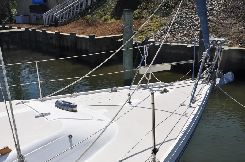 Slide: The Image of 1987 Catalina 36 Tall Rig sailboat docked in a marina. - 4