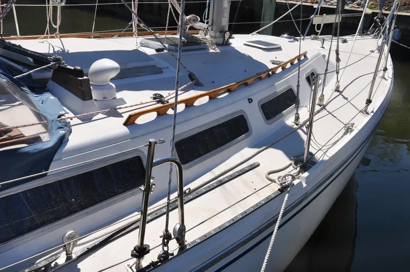 Slide: The Image of 1987 Catalina 36 Tall Rig sailboat deck with rigging and cabin windows. - 6