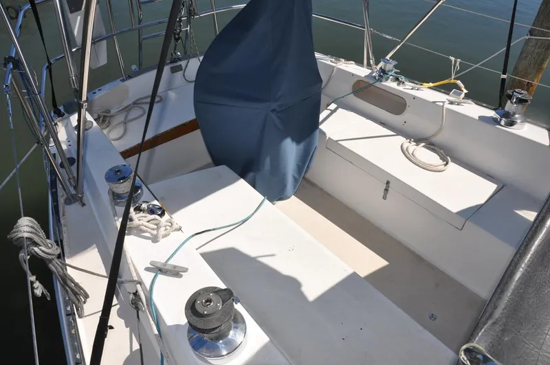 Slide: The Image of 1987 Catalina 36 Tall Rig sailboat cockpit with winches and covered wheel. - 8