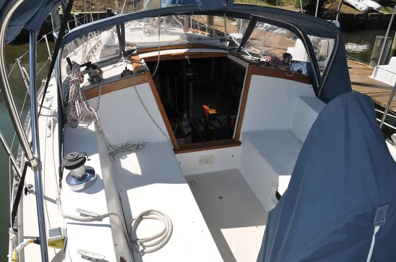 Slide: The Image of 1987 Catalina 36 Tall Rig sailboat cockpit with seating and covered helm. - 9