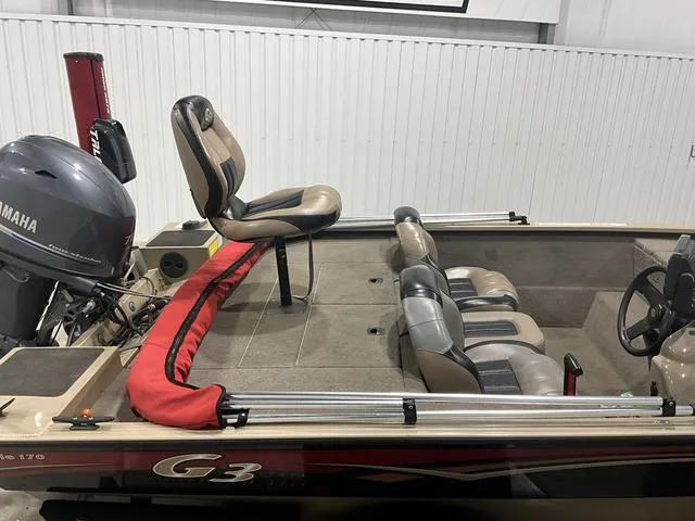 Slide: The Image of 2011 G3 170 boat interior with Yamaha motor and seating arrangement. - 10