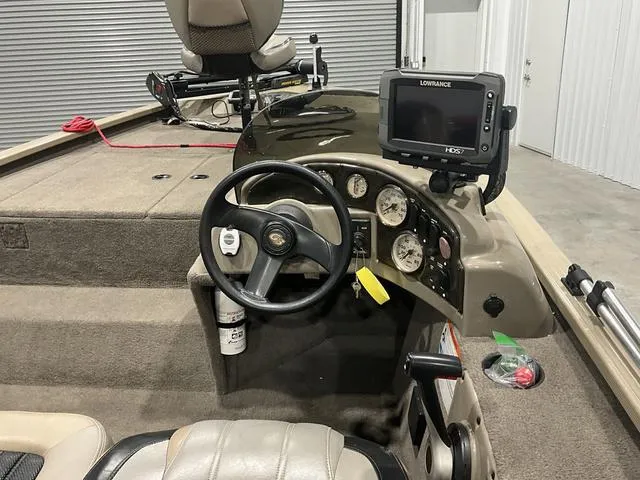 Slide: The Image of Steering console of a 2011 G3 170 boat with Lowrance fishfinder. - 11