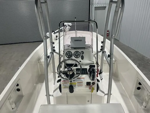 Slide: The Image of 2021 Bayliner T21BAY boat interior with steering console and Simrad navigation system. - 13