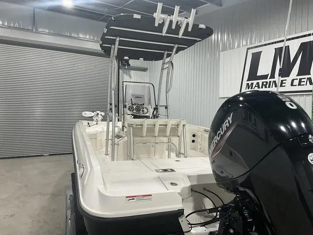 Slide: The Image of 2021 Bayliner T21BAY boat with Mercury engine in a marine center showroom. - 15