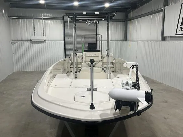 Slide: The Image of 2021 Bayliner T21BAY boat in a garage, front view, well-lit environment. - 8