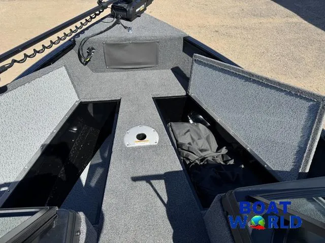 Slide: The Image of 2023 Lund 1675 Adventure Sport boat interior with storage compartments open. - 14