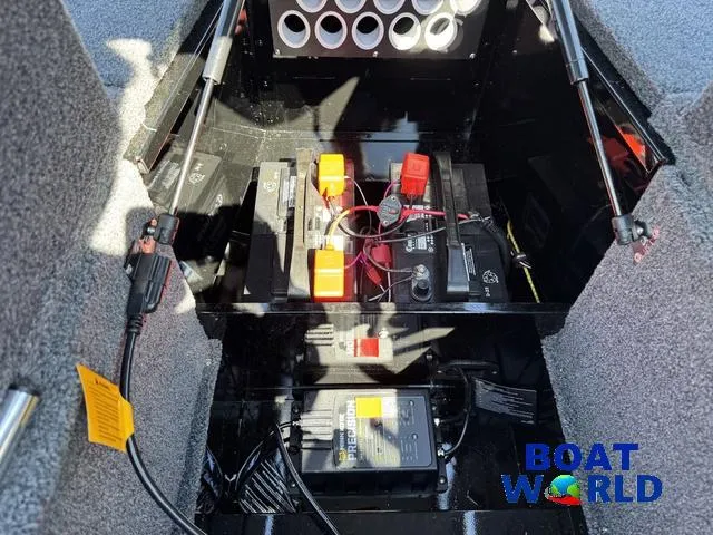 Slide: The Image of 2023 Lund 1675 Adventure Sport boat battery compartment with wiring and components. - 19