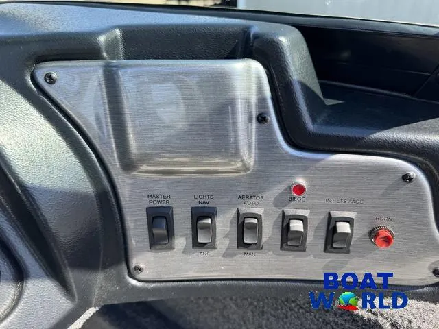 Slide: The Image of Control panel of 2023 Lund 1675 Adventure Sport boat with various switches. - 26