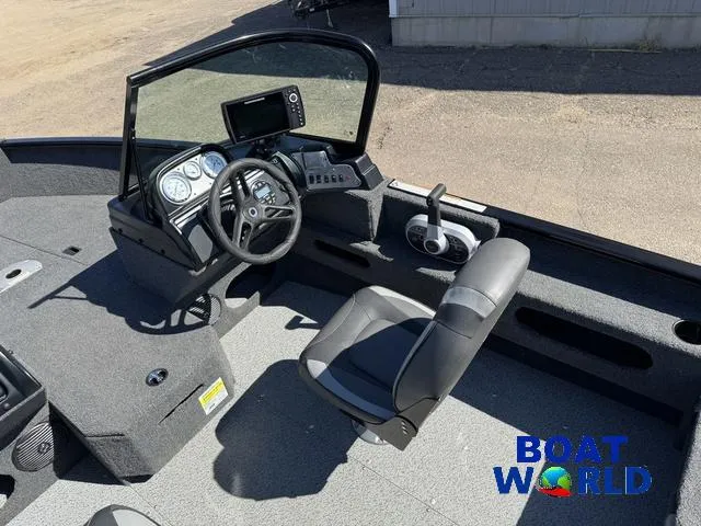 Slide: The Image of 2023 Lund 1675 Adventure Sport boat interior with steering console and seating. - 27