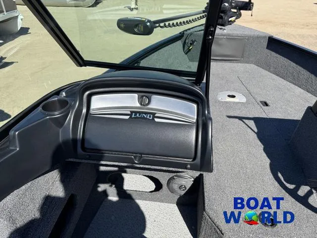 Slide: The Image of 2023 Lund 1675 Adventure Sport boat interior with windshield and storage compartment. - 28