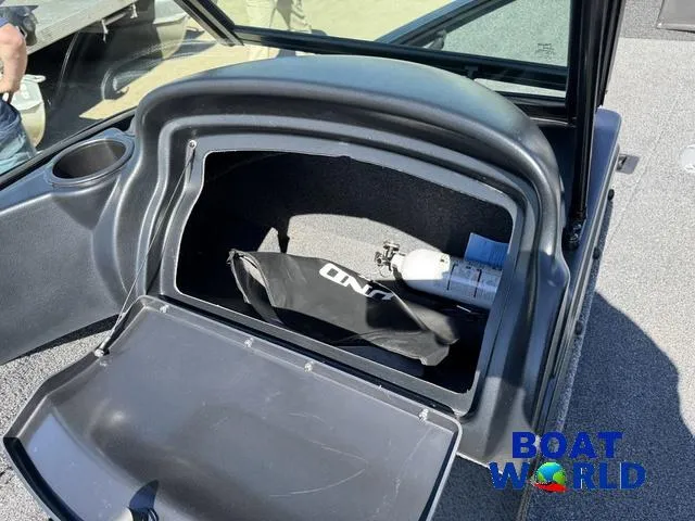 Slide: The Image of 2023 Lund 1675 Adventure Sport storage compartment with fire extinguisher and accessories. - 29