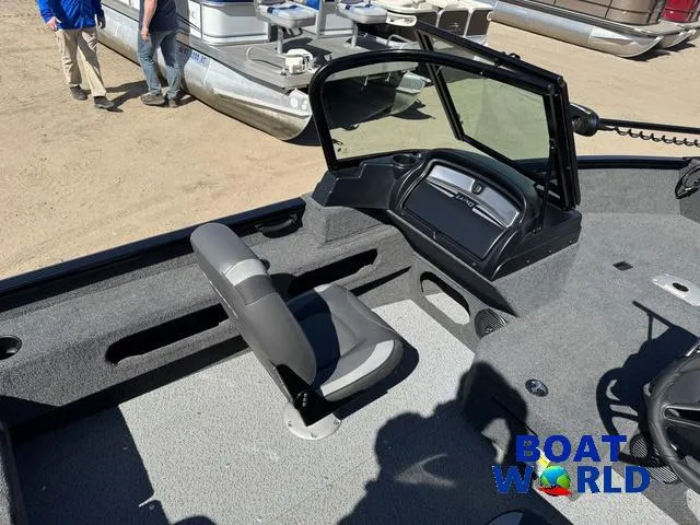 Slide: The Image of 2023 Lund 1675 Adventure Sport boat interior with seating and console, displayed at Boat World. - 30