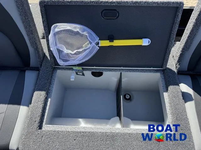 Slide: The Image of 2023 Lund 1675 Adventure Sport boat storage compartment with fishing net, showcased by Boat World. - 35