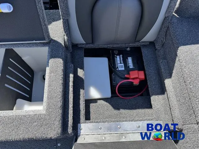Slide: The Image of 2023 Lund 1675 Adventure Sport boat battery compartment with storage and seating. - 37