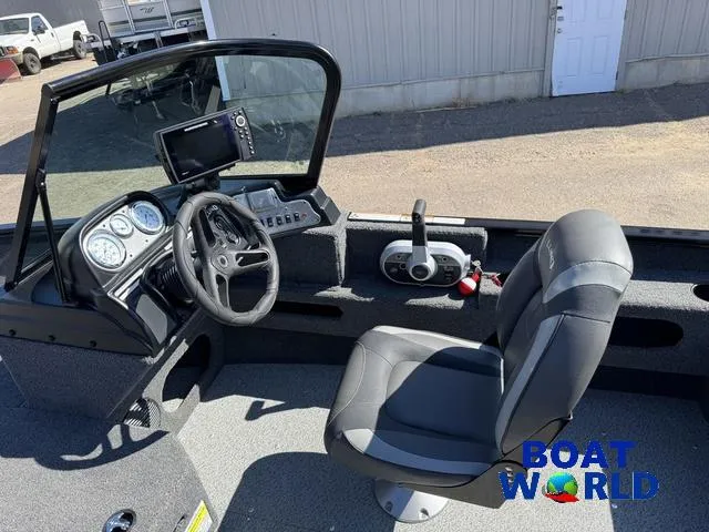 Slide: The Image of 2023 Lund 1675 Adventure Sport boat interior with steering wheel and control panel. - 39