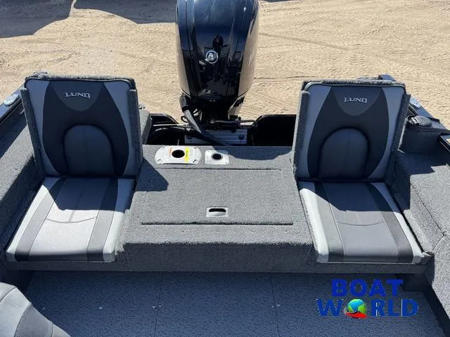 Slide: The Image of 2023 Lund 1675 Adventure Sport boat interior with two seats and motor. - 9