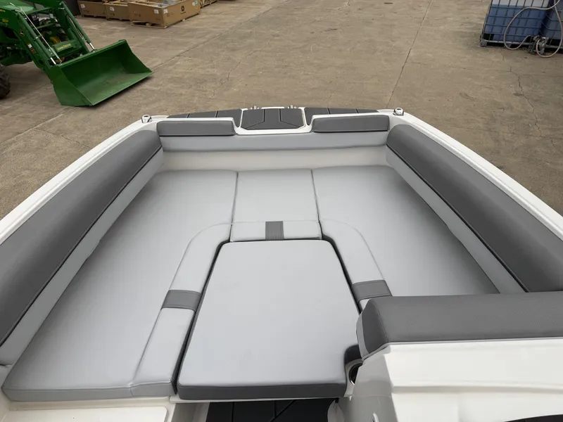 Slide: The Image of 2025 Bayliner D20 boat interior with gray cushioned seating. - 10