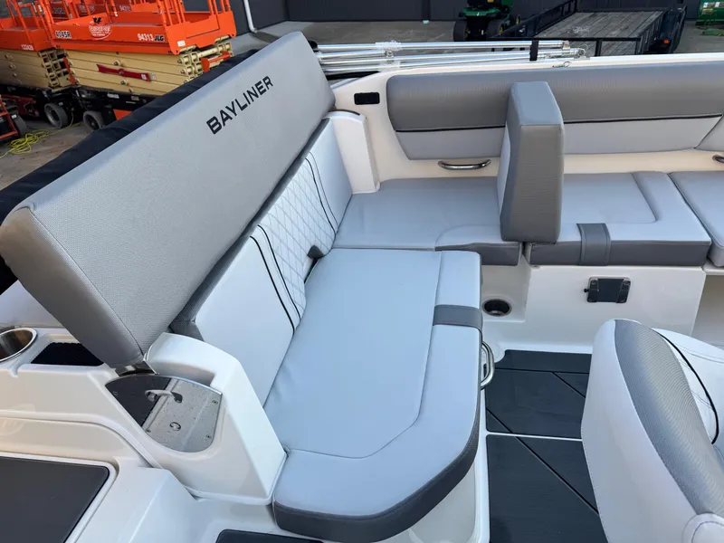Slide: The Image of 2025 Bayliner D20 boat interior with gray seating and modern design. - 13