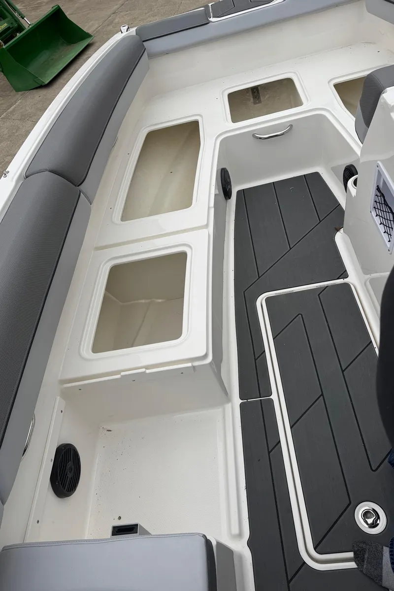 Slide: The Image of 2025 Bayliner D20 boat interior with seating and storage compartments. - 17