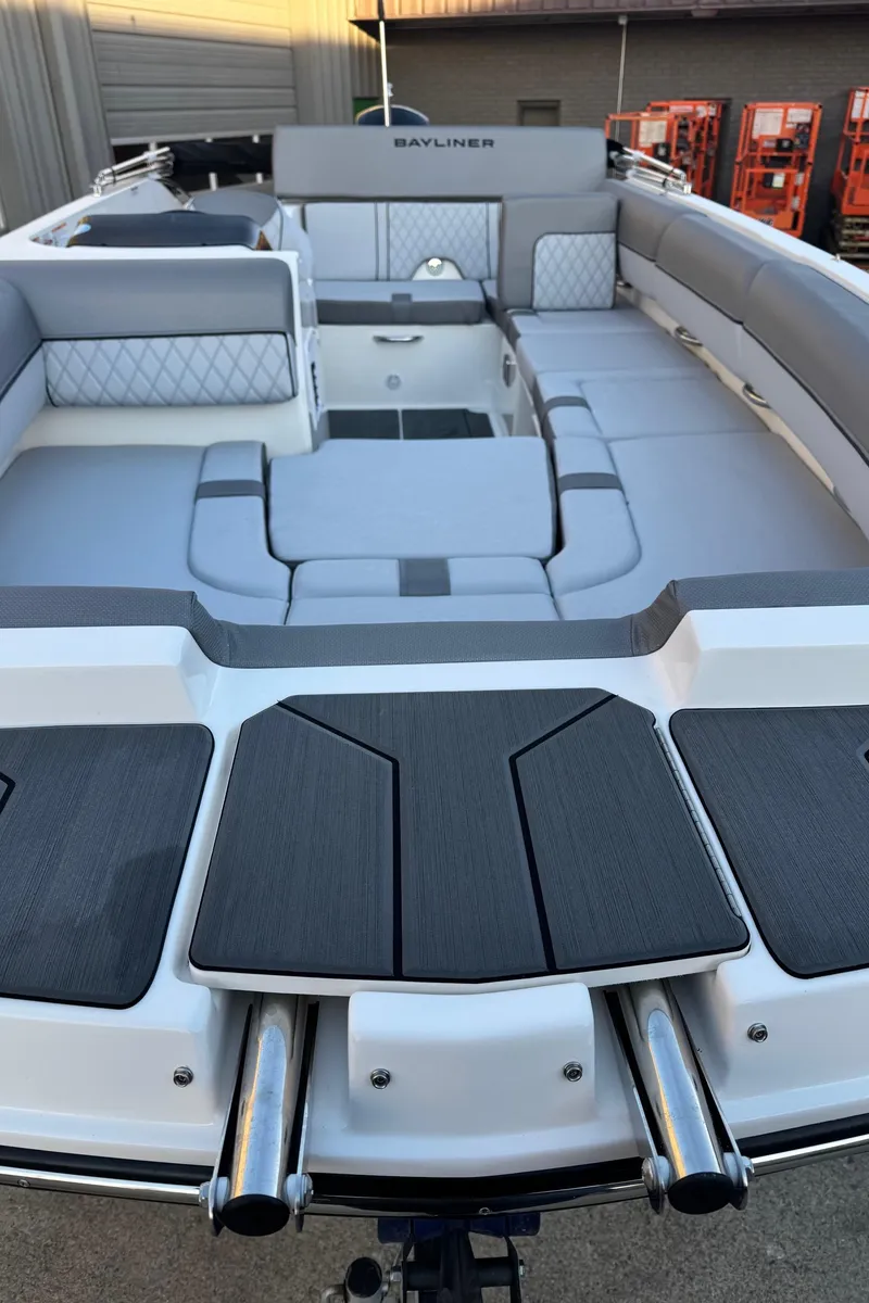 Slide: The Image of 2025 Bayliner D20 boat with spacious seating and modern design. - 5