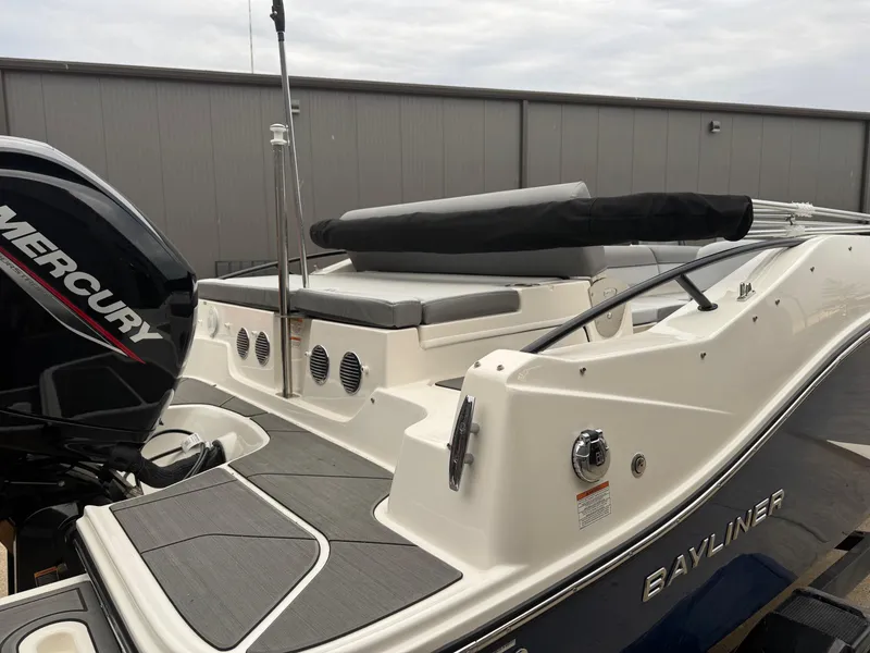 Slide: The Image of 2025 Bayliner D20 boat with Mercury engine, docked, featuring sleek design and modern amenities. - 8