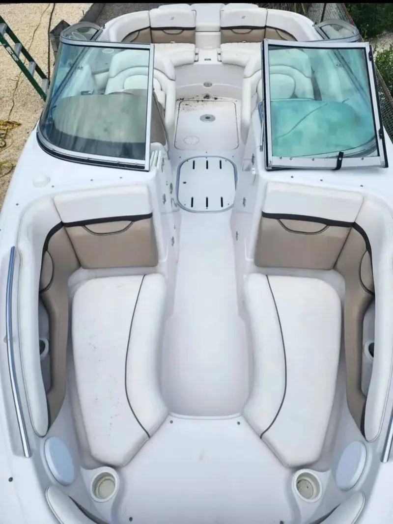 Slide: The Image of 2005 Four Winns 230 Horizon boat interior with spacious seating and open bow design. - 2