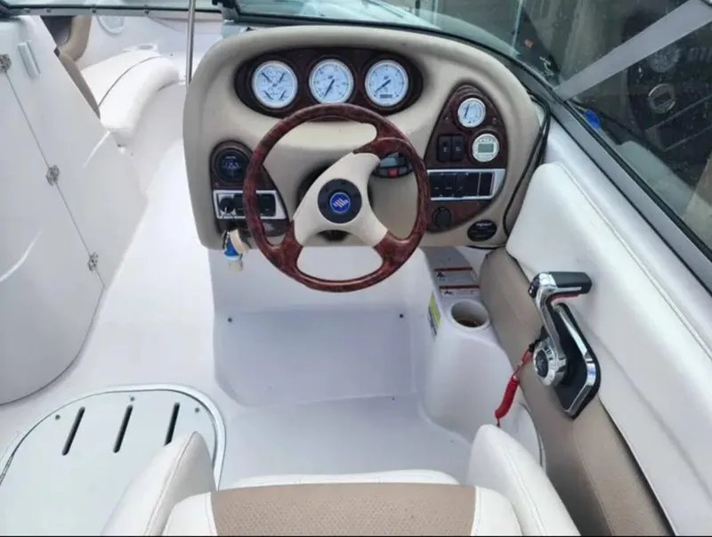Slide: The Image of 2005 Four Winns 230 Horizon boat cockpit with steering wheel and instrument panel. - 3