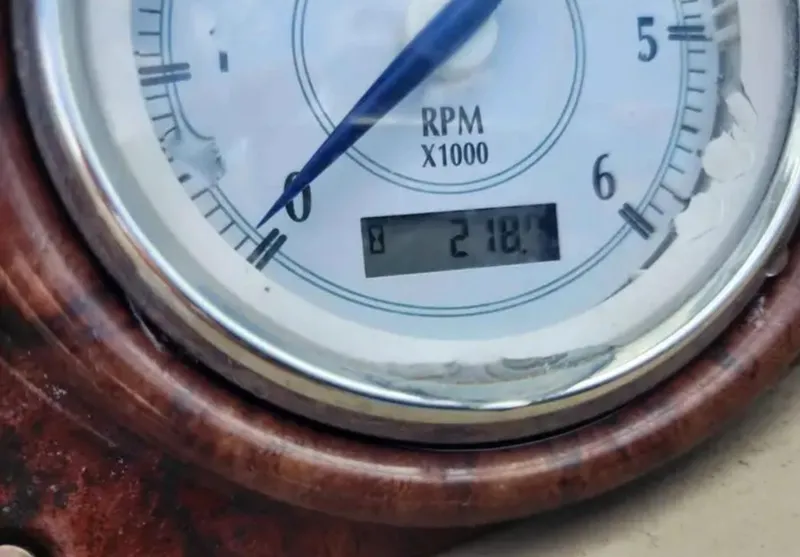 Slide: The Image of Close-up of 2005 Four Winns 230 Horizon RPM gauge displaying 218.4 hours. - 4
