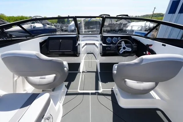 Slide: The Image of Interior of 2025 Bayliner V20i boat with modern dashboard and seating. - 14