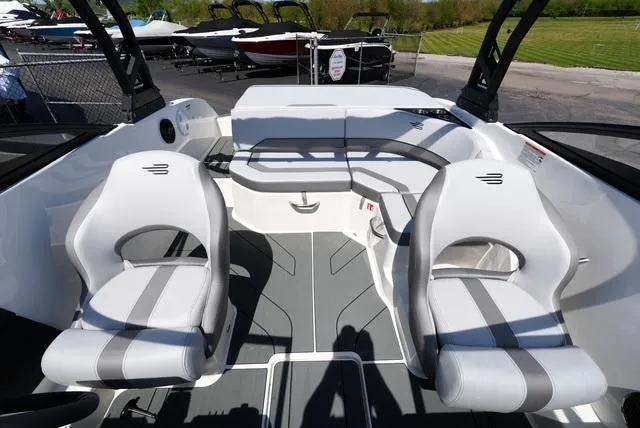 Slide: The Image of Interior of 2025 Bayliner V20i boat with modern seating and sleek design. - 18