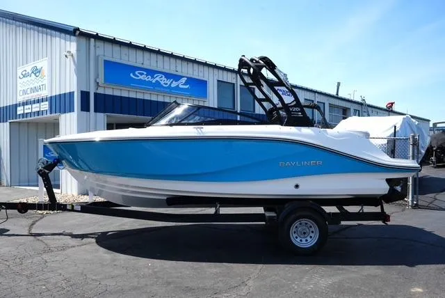Slide: The Image of 2025 Bayliner V20i boat on trailer outside dealership. - 21