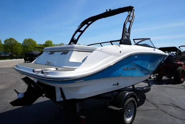 Slide: The Image of 2025 Bayliner V20i boat on trailer, featuring sleek design and blue accents. - 7