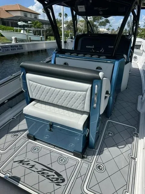 Slide: The Image of 2024 Nor-Tech 390 Sport boat interior with luxury seating and modern design. - 18